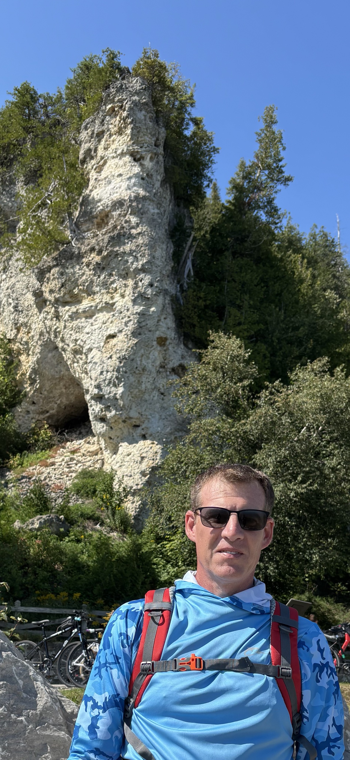Keith Rockhill hiking near a rock formation in Michigan