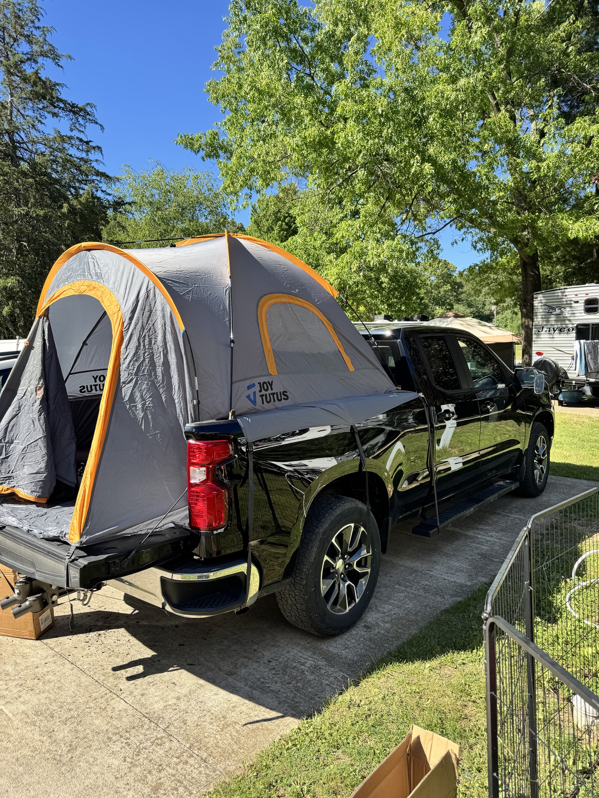 Truck bed tent camping setup